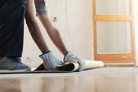 Premium Photo | Contractor removing an old linoleum flooring