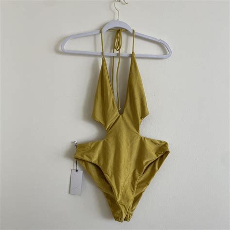 Yellow one piece swim suit Never worn Tag still... - Depop