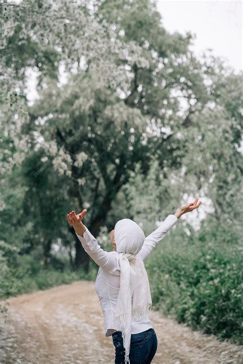Woman with white headscarf in the forest | Premium Photo