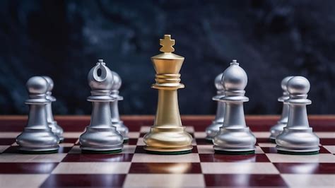Gold and silver chess on chess board game for business metaphor ...