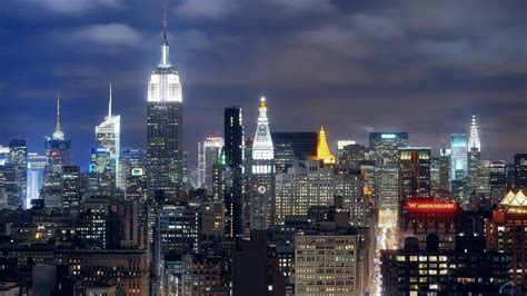 Download Empire State Building In Bright City Wallpaper | Wallpapers.com