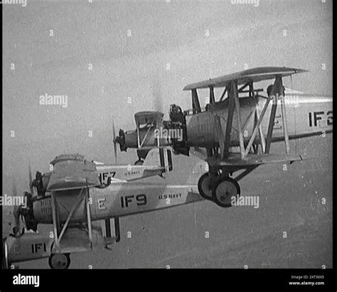 A Fleet of US Fighter Planes Mid Flight, 1920s. US Navy Naval Aircraft Factory TS-1 fighters ...
