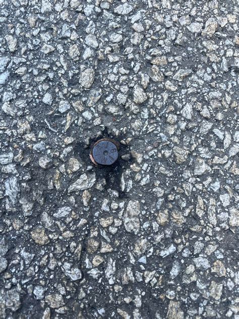 What is this thing found in road about the size of a dime it has a 6 ...