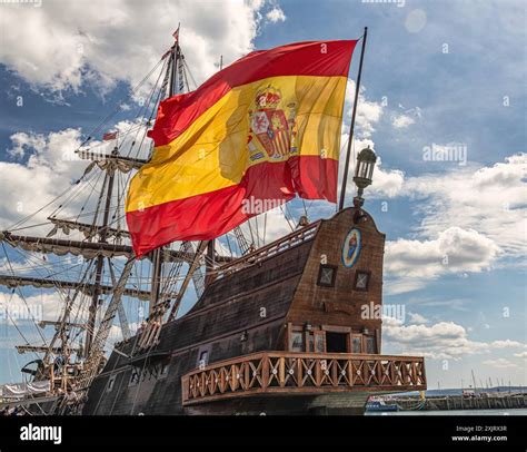 A replica of a 17th Century Spanish galleon moored in harbour. Tourists ...