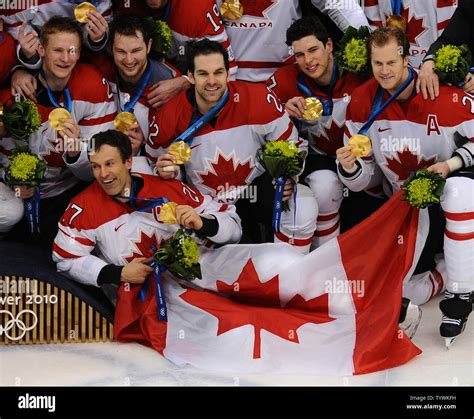 Team Canada celebrates their medals after beating USA in overtime of ...