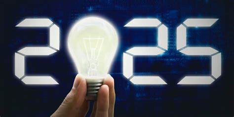 2025 numbers and light bulb in hand | Premium Photo