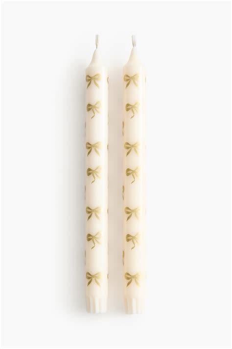 2-pack patterned candles - Gold-coloured/Bows - Home All | H&M IN