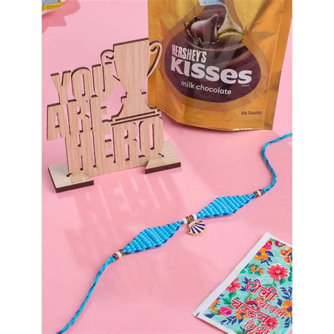 Buy NVR Blue Thread Rakhi with Chocolate and Mdf Stand (Set of 3) Online