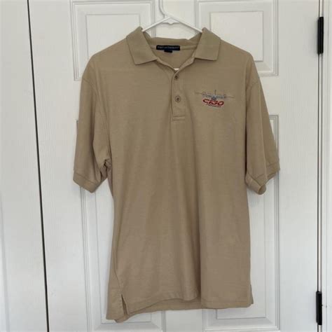 Port Authority men's tan polo shirt cool plane... - Depop