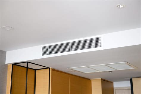 Ceiling mounted cassette type air conditioner and modern lamp light on ...