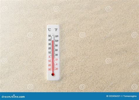 Celsius and Fahrenheit Scale Thermometer in the Sand. Ambient ...