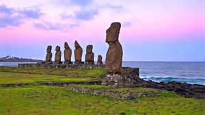 Moai statues standing above the Pacific Ocean