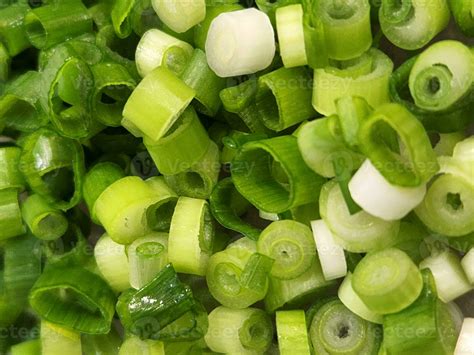 Green onions. Chopped green onions for salads. Culinary background of ...
