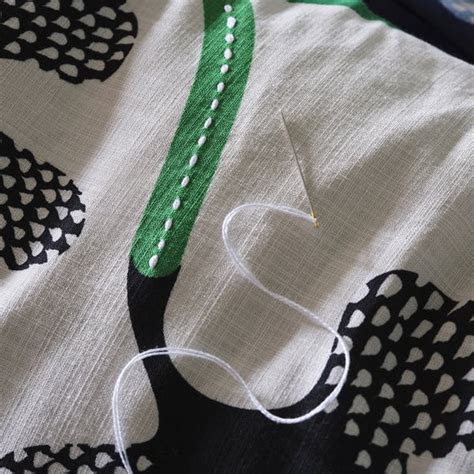 MÄVINN cushion cover, off-white black/floral pattern, 40x58 cm (16x23 ...