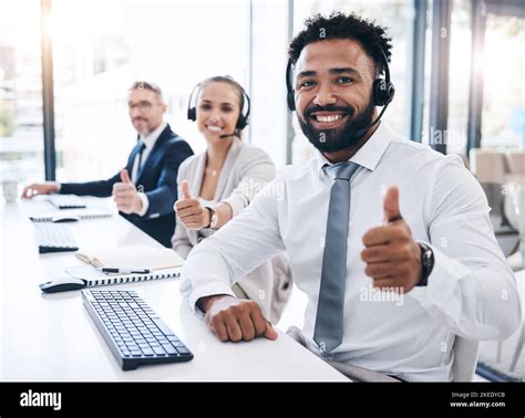 Thumbs up, call center staff and black man, success in the workplace ...