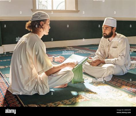 Quran, muslim and mosque with an imam teaching a student about religion ...