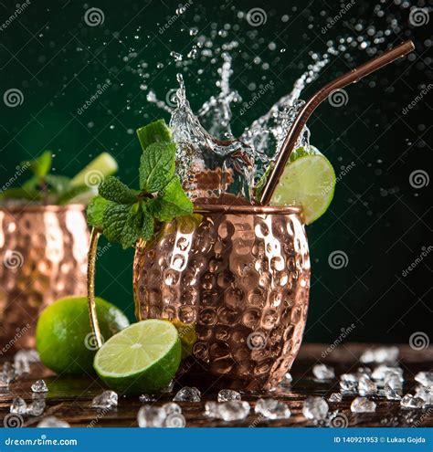 Famous Splashing Moscow Mule Alcoholic Cocktail in Copper Mugs. Stock ...