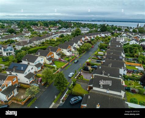 Aerial view of upper middle class Irish neighborhood with single family ...
