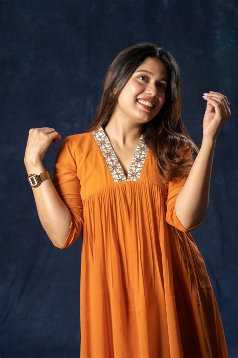 Alia cut A-line georgette kurti with thread worked collar in rust oran ...