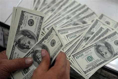 Rupee up marginally by 2 paise, US-China trade tiff weighs