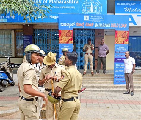 Police personnel stand guard outside Maharashtra Bank