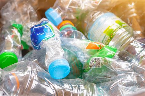 Premium Photo | Hand hold old plastic bottles and containers set for ...