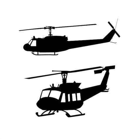 Silhouette of helicopters in flight | Premium Vector