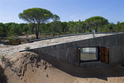 Concrete House Buried Under Artificial Sand Dunes
