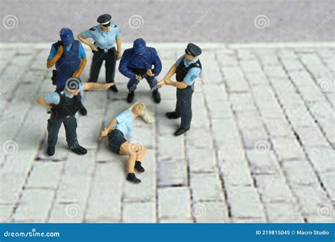 Miniature People of a Girl or Woman Arrested by Police and Military Security Officer Stock Image ...