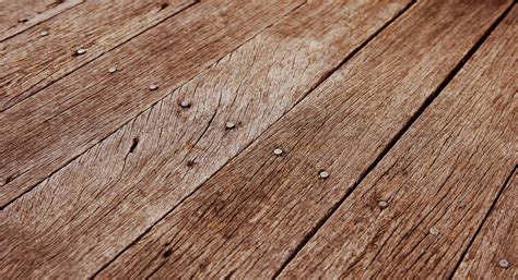 closeup photo of some old rough wooden floor boards background texture ...