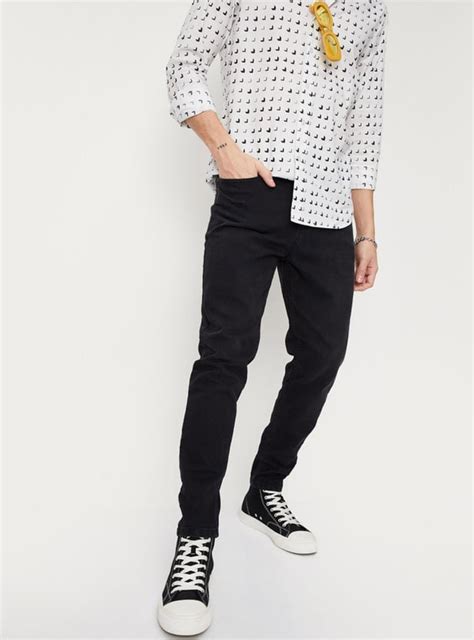 Buy Men Solid Carrot Fit Jeans Online at just Rs. 1299.0 ...