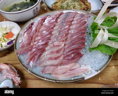 Bangeo hoe is a traditional Korean dish made with fermented skate fish ...