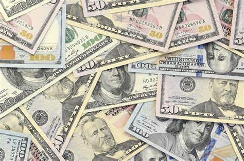 Premium Photo | Many one hundred and fifty dollar bills on flat ...