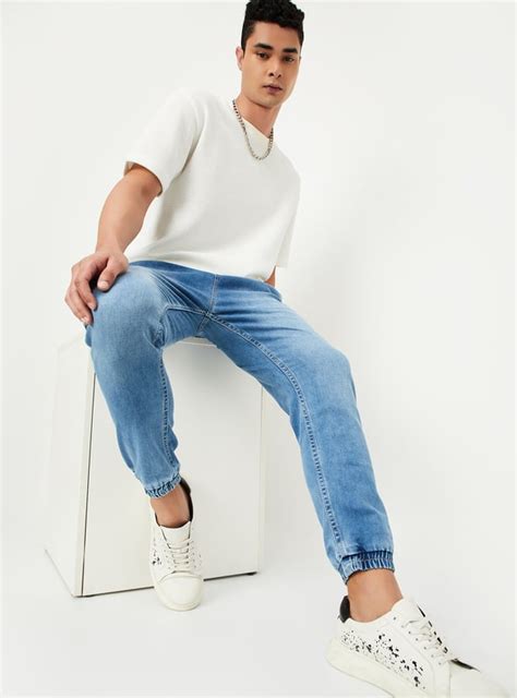 Buy Men Carrot Fit Washed Denim Joggers Online at just Rs. 1499.0 ...