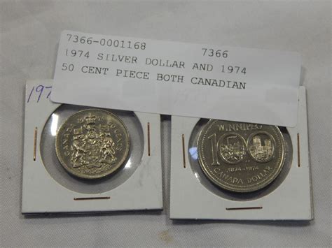 1974 SILVER DOLLAR AND 1974 50 CENT PIECE BOTH CANADIAN