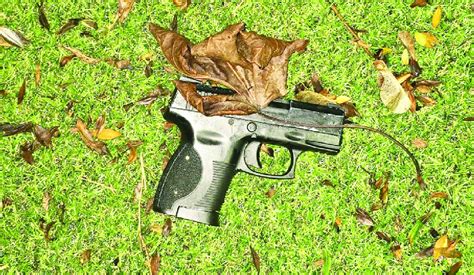 Juvenile held after gun photos on social media; pistol seized