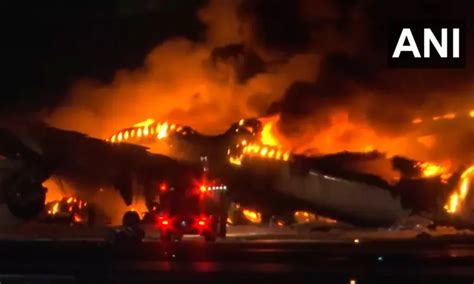 Plane catches fire on runway at Japan's Haneda airport, passengers ...