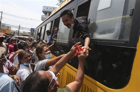 A released prisoner, right, is welcomed by her colleague after she was released from Insein Prison Sunday, Jan. 4, 2026, in Yangon, Myanmar. (AP Photo/Thein Zaw)