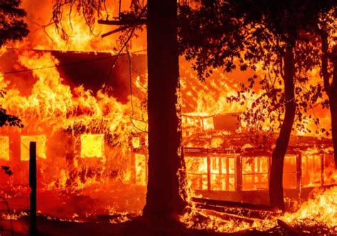 Californias largest fire burns homes as blazes scorch US West