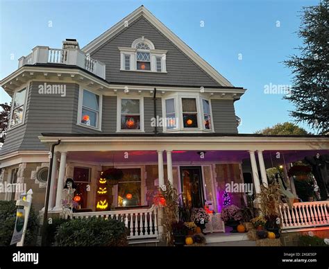 A historic home in Salem Massachusetts is illuminated with Halloween ...