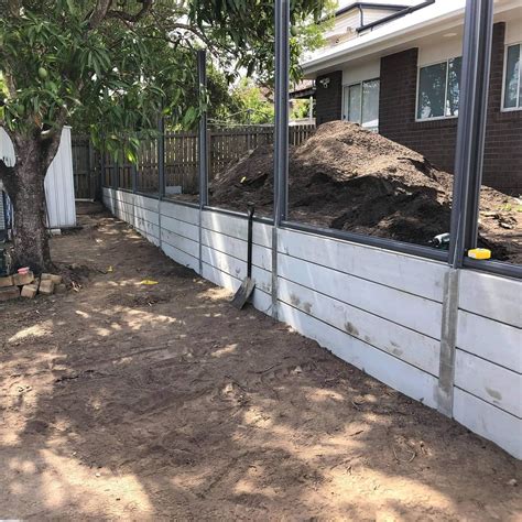 Goodna retaining wall and colorbond fence Rogers Little Loaders ...