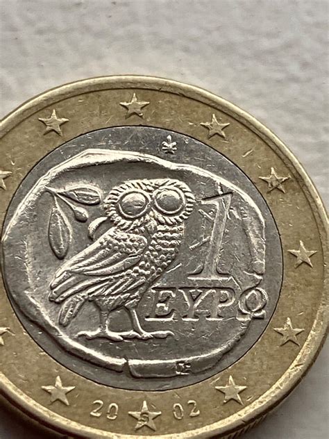 A 2002 One Euro coin with owl Greek with 1 defect and rare s on coin ...