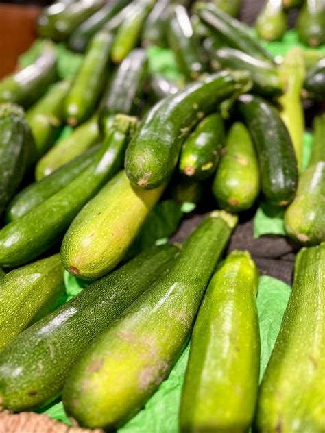A bunch of cucumbers sitting on top of a table photo – Free Food Image ...