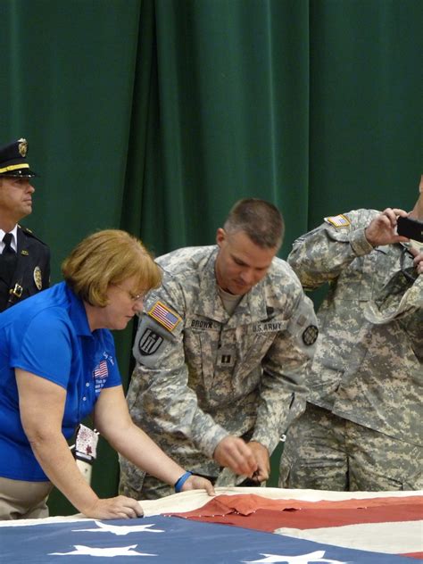 Soldiers, first responders, citizens stitch 9/11 memorial flag in ...