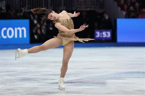 Feb 19, 2026; Milan, Italy; Alysa Liu of the United States celebrates with the gold medal in the women's free skate during the Milano Cortina 2026 Olympic Winter Games at Milano Ice Skating Arena. Mandatory Credit: James Lang-Imagn Images
