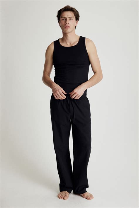 Relaxed Fit Poplin trousers - Black - Men | H&M IN