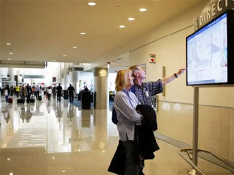 Flight information screens at the new terminal - Terminal at Atlanta ...