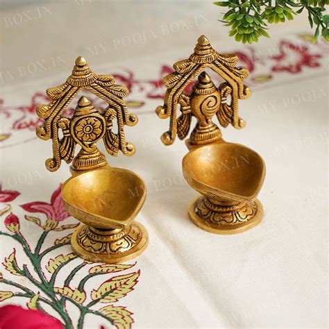 Buy Shankh Chakra Brass Diya Set of 2 Online in India - Mypoojabox.in