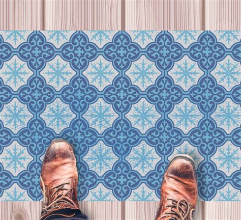 Snowflake emblem tile vinyl rug