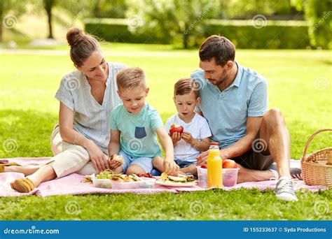 Happy Family Having Picnic in the Park Stock Photo - Image of children ...